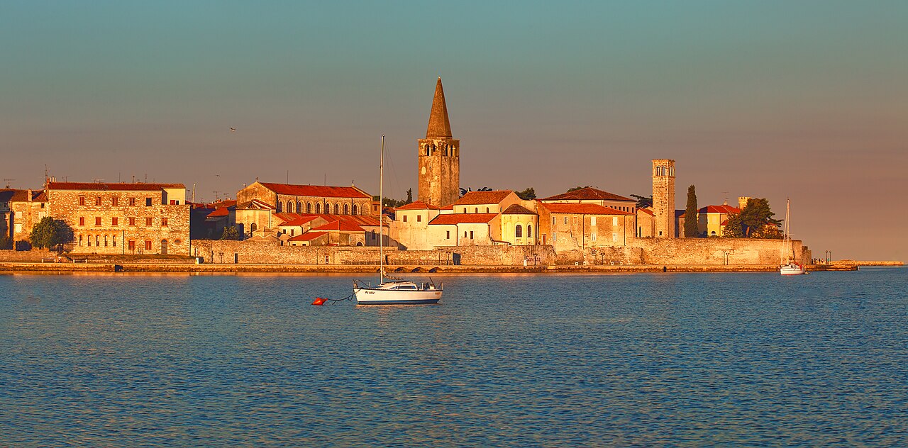 Poreč waterfront with historic peninsula and Euphrasian Basilica campanile visible