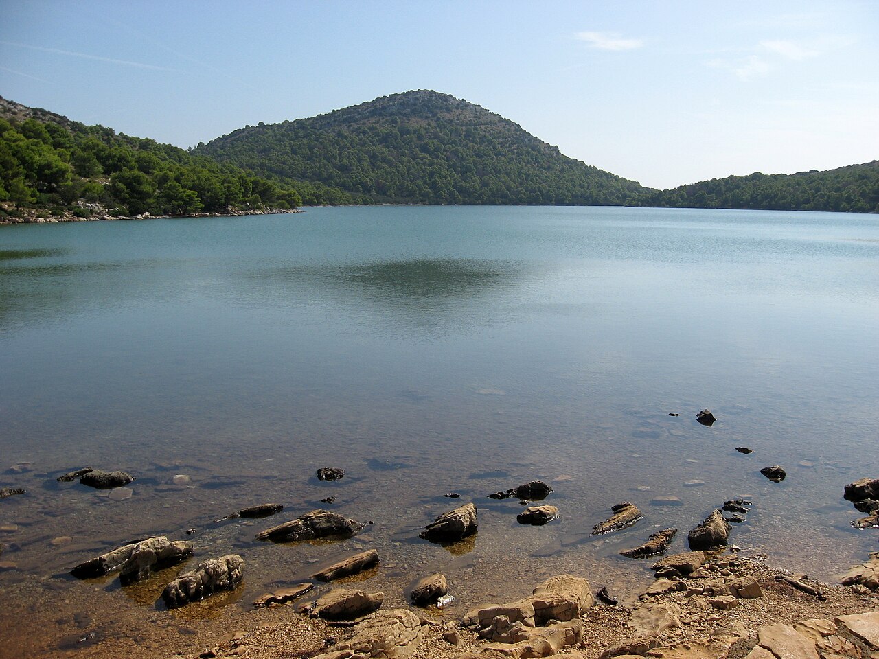 Salt lake Mir in Telašćica Nature Park surrounded by Mediterranean vegetation with turquoise healing waters warmer than the Adriatic Sea